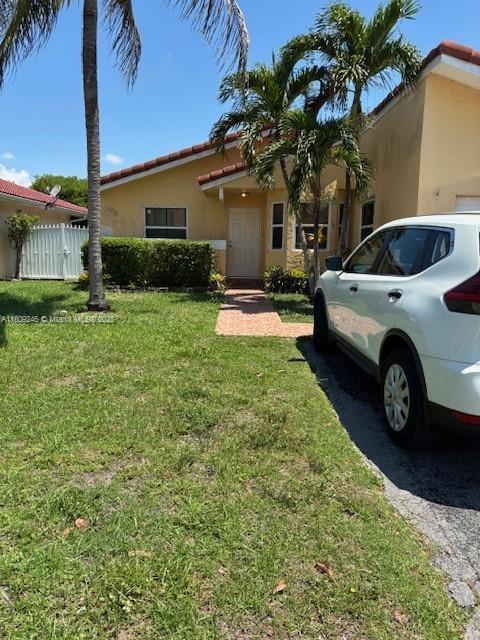 10813 SW 158th Ln, Miami, FL 33157 - view of front facade featuring stucco siding and a tiled roof