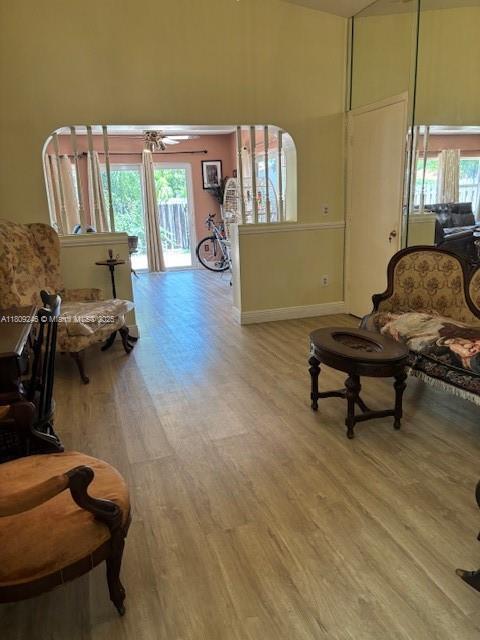 10813 SW 158th Ln, Miami, FL 33157 - living room with wood finished floors, baseboards, and a towering ceiling