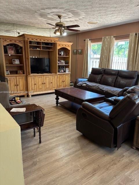 10813 SW 158th Ln, Miami, FL 33157 - living area with a ceiling fan, light wood-style floors, and a textured ceiling