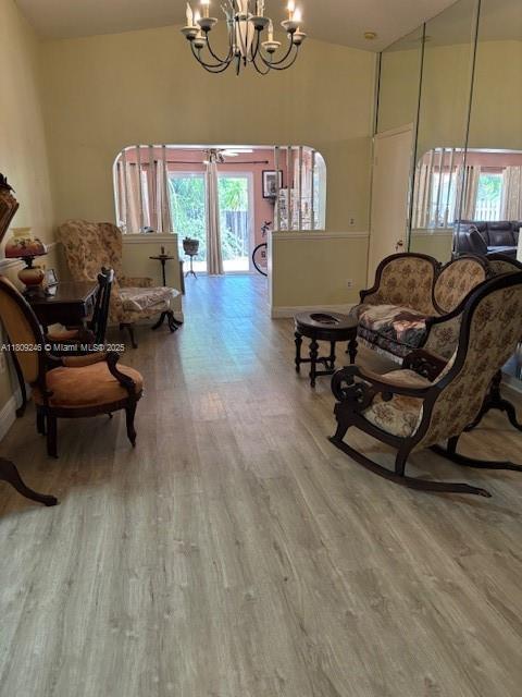 10813 SW 158th Ln, Miami, FL 33157 - sitting room featuring a chandelier, wood finished floors, and a high ceiling