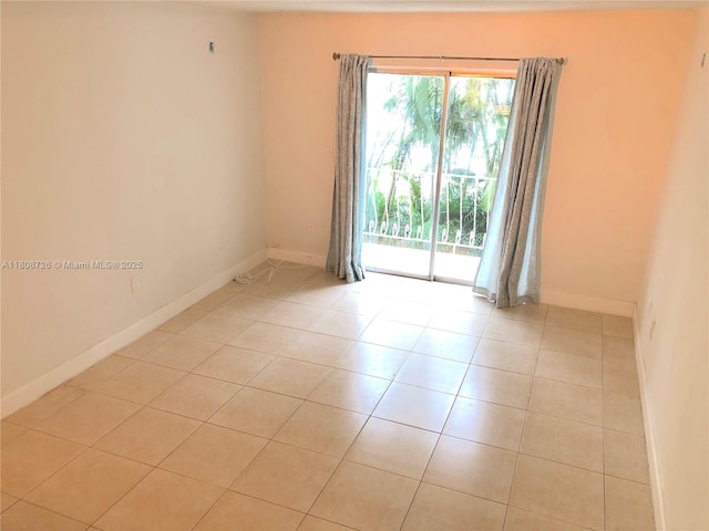 4301 NW S Tamiami Canal Dr Unit 3-209, Miami, FL 33126 - spare room featuring light tile patterned flooring and baseboards