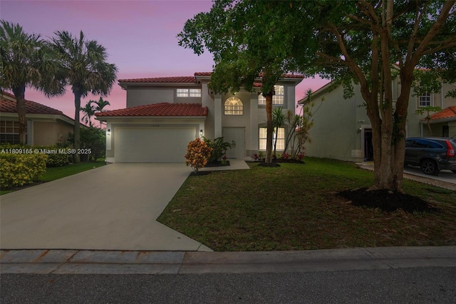 10728 Oak Lake Way, Boca Raton, FL 33498 - mediterranean / spanish house with a tiled roof, a garage, concrete driveway, stucco siding, and a yard