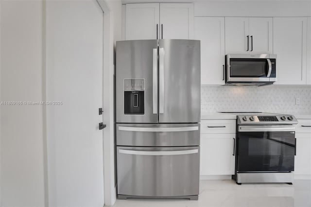 10728 Oak Lake Way, Boca Raton, FL 33498 - kitchen with appliances with stainless steel finishes, white cabinets, light countertops, tasteful backsplash, and light marble finish floors
