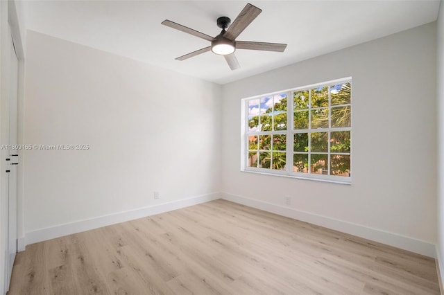 10728 Oak Lake Way, Boca Raton, FL 33498 - spare room with wood finished floors, ceiling fan, and baseboards