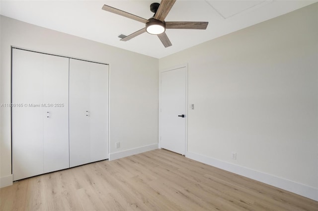10728 Oak Lake Way, Boca Raton, FL 33498 - unfurnished bedroom featuring light wood-type flooring, baseboards, a closet, and a ceiling fan