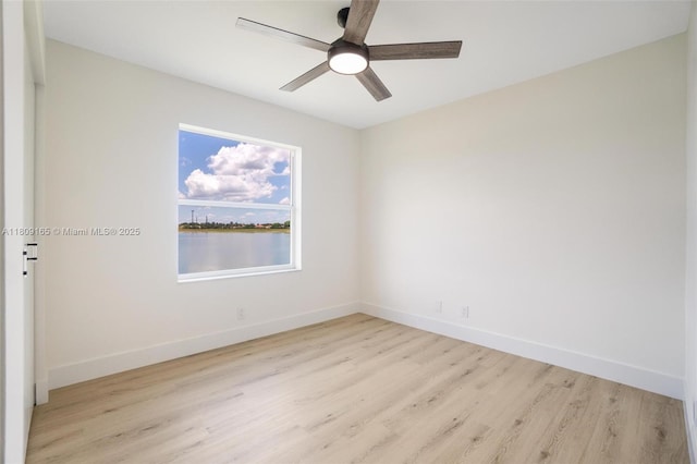 10728 Oak Lake Way, Boca Raton, FL 33498 - unfurnished room with wood finished floors, a ceiling fan, and baseboards