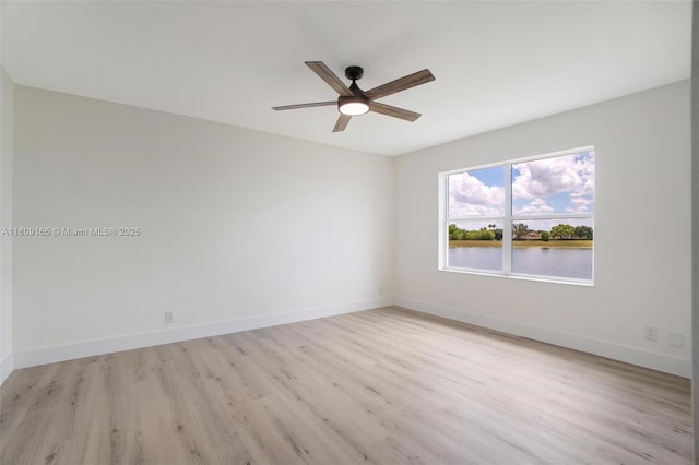 10728 Oak Lake Way, Boca Raton, FL 33498 - unfurnished room with light wood-style floors, ceiling fan, and baseboards
