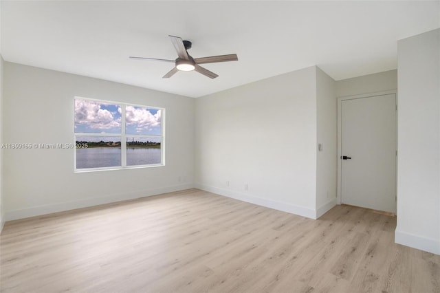 10728 Oak Lake Way, Boca Raton, FL 33498 - empty room featuring ceiling fan, light wood finished floors, and baseboards
