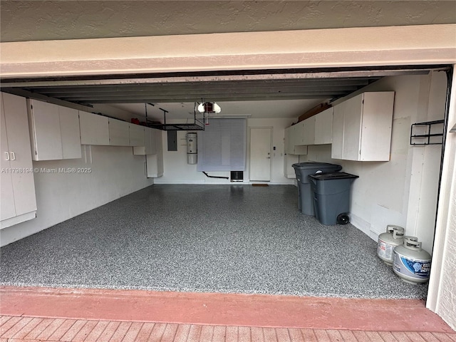 19401 Preserve Dr, Boca Raton, FL 33498 - garage with a garage door opener, electric panel, and a central vacuum unit