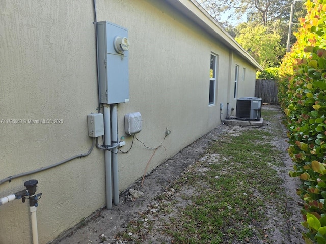 4815 Jefferson Rd, Delray Beach, FL 33445 - view of home's exterior with central AC and stucco siding