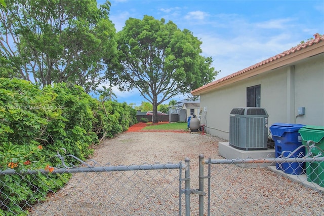 17375 SW 282nd St, Homestead, FL 33030 - fenced backyard featuring central air condition unit and a gate
