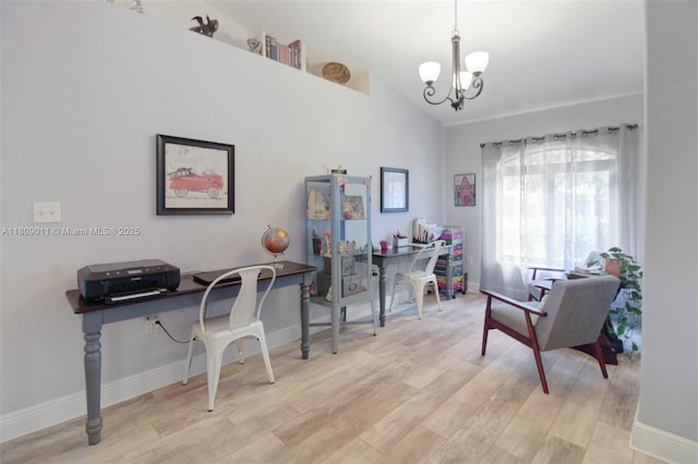 17375 SW 282nd St, Homestead, FL 33030 - office with a chandelier, baseboards, wood finished floors, and lofted ceiling