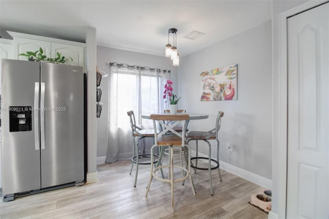 17375 SW 282nd St, Homestead, FL 33030 - dining space featuring light wood-style flooring and baseboards