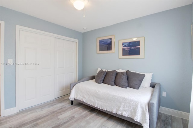 17375 SW 282nd St, Homestead, FL 33030 - bedroom with a closet, wood finished floors, and baseboards