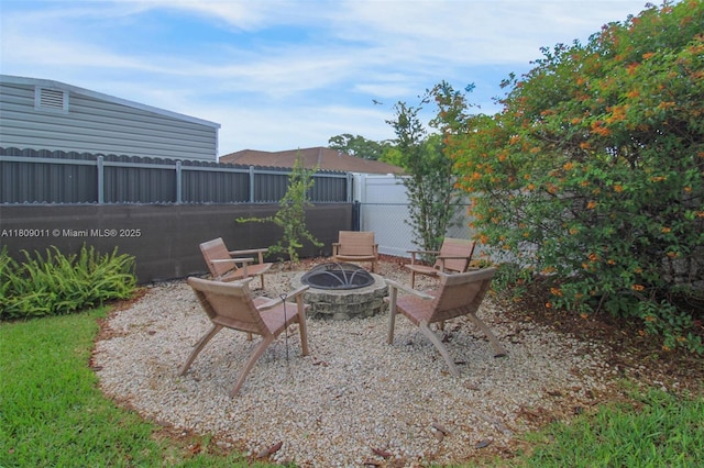 17375 SW 282nd St, Homestead, FL 33030 - fenced backyard with an outdoor fire pit