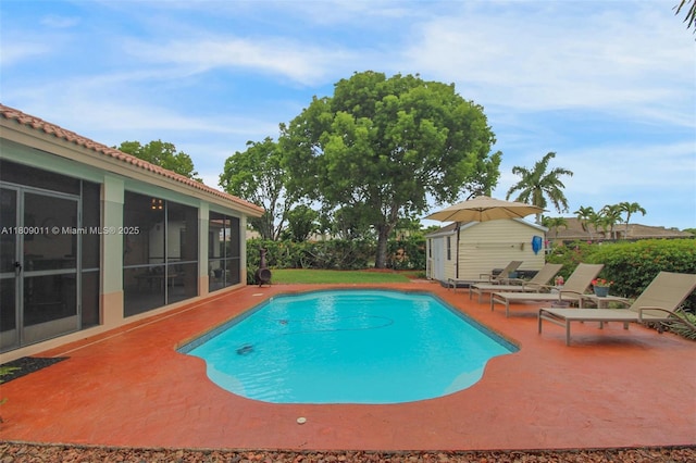 17375 SW 282nd St, Homestead, FL 33030 - view of pool with a patio area, a sunroom, and an outdoor structure