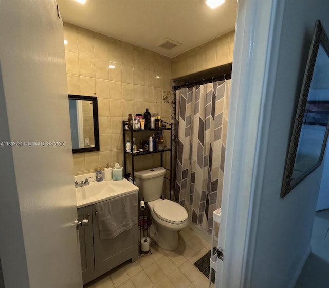13320 SW 99th St, Miami, FL 33186 - full bath with tile patterned floors, tile walls, vanity, toilet, and curtained shower
