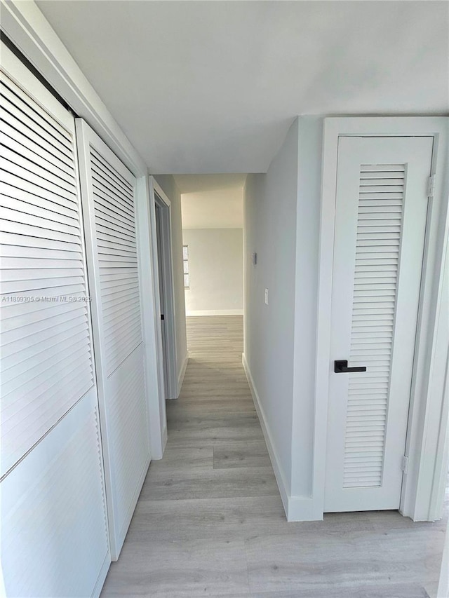 1490 NW 43rd Ave Unit 301, Lauderhill, FL 33313 - corridor with baseboards and light wood-style floors