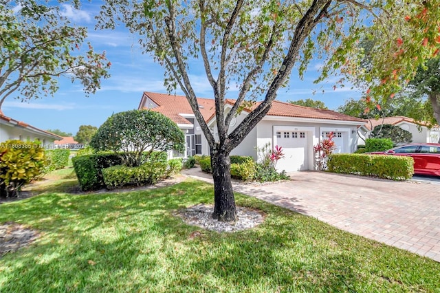 7713 Springwater Pl, Boynton Beach, FL 33437 - view of front of home with stucco siding, an attached garage, decorative driveway, a front yard, and a tiled roof