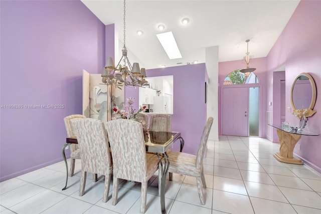 7713 Springwater Pl, Boynton Beach, FL 33437 - tiled dining space featuring a skylight, a chandelier, baseboards, and high vaulted ceiling
