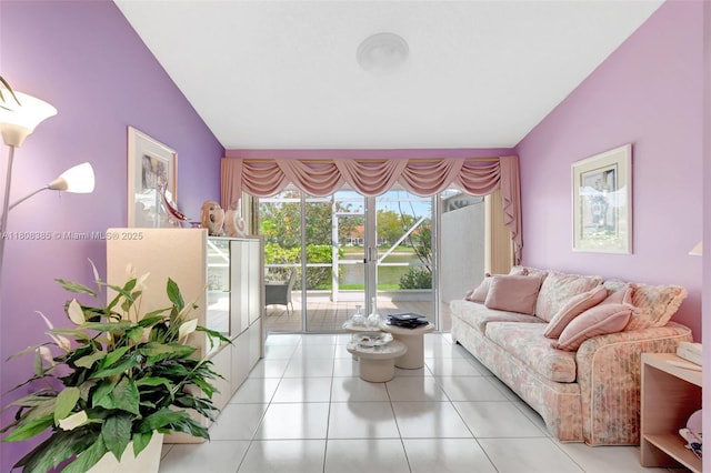 7713 Springwater Pl, Boynton Beach, FL 33437 - living room featuring vaulted ceiling and light tile patterned floors