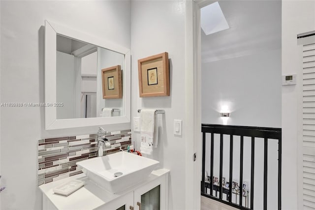 21388 Marina Cove Cir Unit 13-G, Aventura, FL 33180 - bathroom with decorative backsplash and vanity