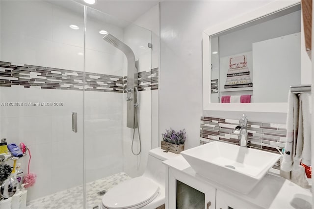 21388 Marina Cove Cir Unit 13-G, Aventura, FL 33180 - full bath with decorative backsplash, a stall shower, toilet, vanity, and recessed lighting