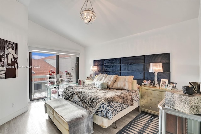 21388 Marina Cove Cir Unit 13-G, Aventura, FL 33180 - bedroom featuring access to outside, lofted ceiling, wood finished floors, and a chandelier