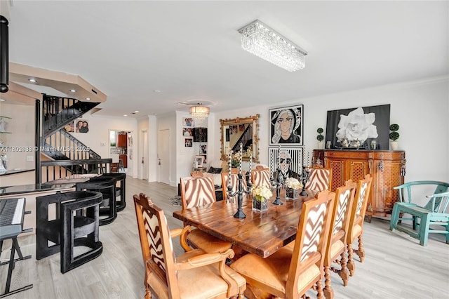 21388 Marina Cove Cir Unit 13-G, Aventura, FL 33180 - dining space with stairs, light wood finished floors, and crown molding