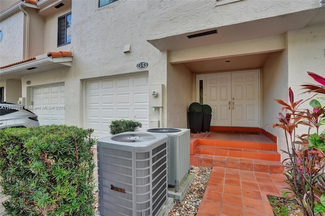 21388 Marina Cove Cir Unit 13-G, Aventura, FL 33180 - exterior view of central AC, stucco siding, and electric meter