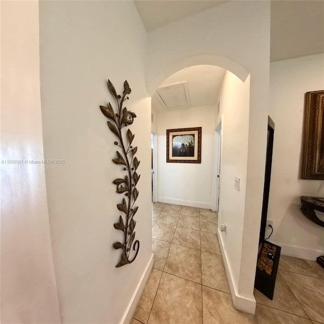 10341 SW 179th St, Miami, FL 33157 - corridor with arched walkways, light tile patterned flooring, and baseboards