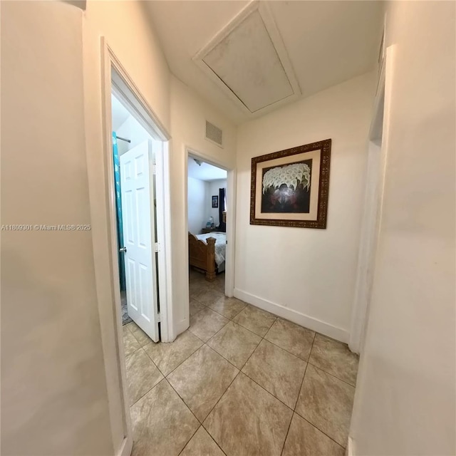 10341 SW 179th St, Miami, FL 33157 - corridor featuring attic access, light tile patterned flooring, and baseboards