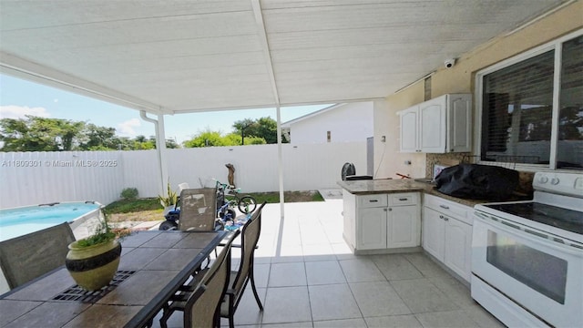 10341 SW 179th St, Miami, FL 33157 - fenced backyard with outdoor dining space, exterior kitchen, and a patio area