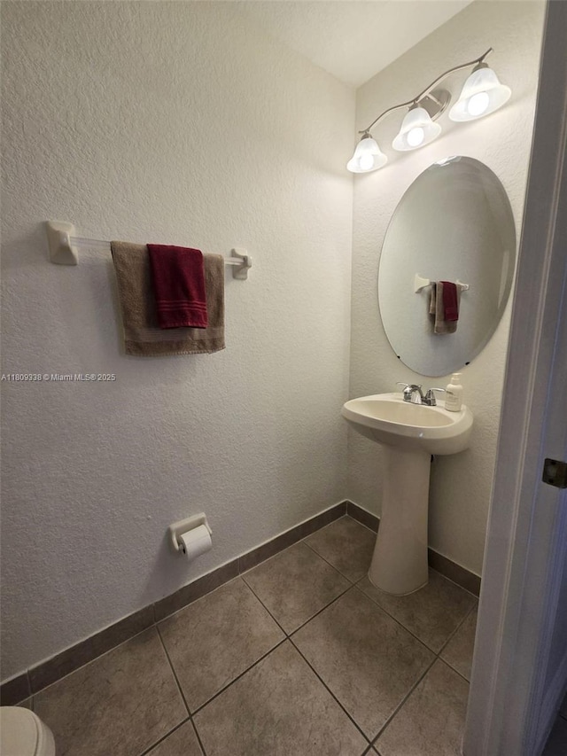 4940 SW 140th Ter Unit 14, Miramar, FL 33027 - bathroom featuring tile patterned flooring and baseboards