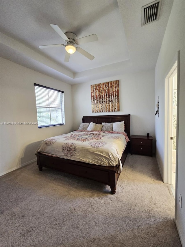 4940 SW 140th Ter Unit 14, Miramar, FL 33027 - carpeted bedroom featuring a raised ceiling, a ceiling fan, and baseboards