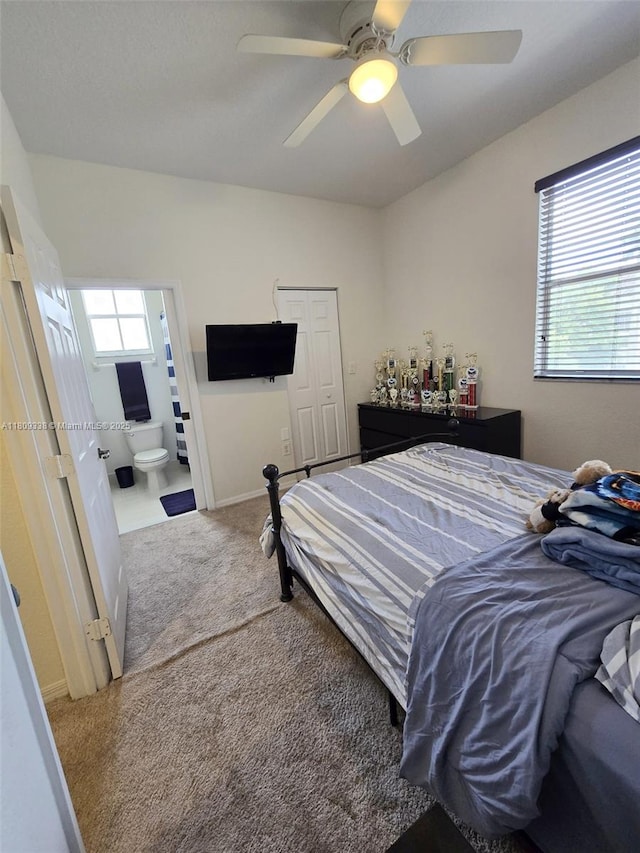 4940 SW 140th Ter Unit 14, Miramar, FL 33027 - bedroom with carpet, ceiling fan, ensuite bath, a closet, and baseboards