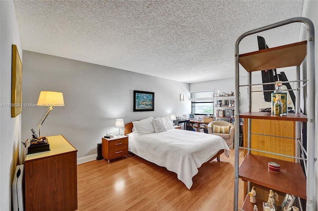 1201 S Ocean Dr Unit 609S, Hollywood, FL 33019 - bedroom featuring wood finished floors, baseboards, and a textured ceiling