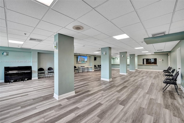 1201 S Ocean Dr Unit 609S, Hollywood, FL 33019 - below grade area featuring wood finished floors, a paneled ceiling, and baseboards