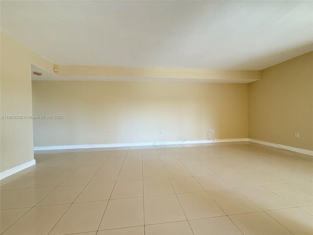 9255 SW 125th Ave Unit 304R, Miami, FL 33186 - spare room with light tile patterned floors