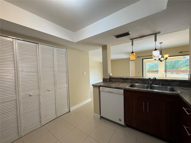 9255 SW 125th Ave Unit 304R, Miami, FL 33186 - kitchen with white dishwasher, dark countertops, a chandelier, and dark brown cabinetry