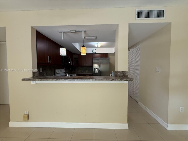 9255 SW 125th Ave Unit 304R, Miami, FL 33186 - kitchen with stainless steel refrigerator with ice dispenser, white range with electric stovetop, tasteful backsplash, and dark countertops