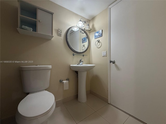 9255 SW 125th Ave Unit 304R, Miami, FL 33186 - half bath featuring toilet and tile patterned flooring