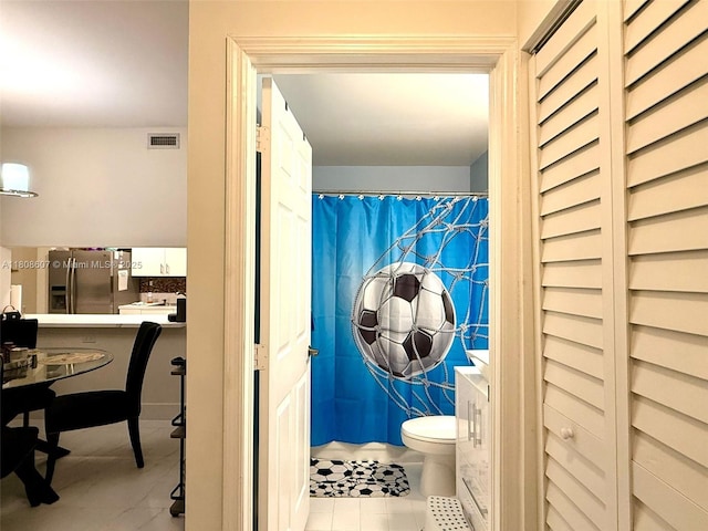 9725 NW 52nd St Unit 421, Doral, FL 33178 - bathroom featuring toilet, tile patterned flooring, and a shower with curtain