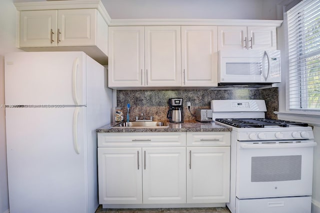 900 16th St Unit 204, Miami Beach, FL 33139 - kitchen featuring white appliances, a sink, decorative backsplash, and white cabinetry