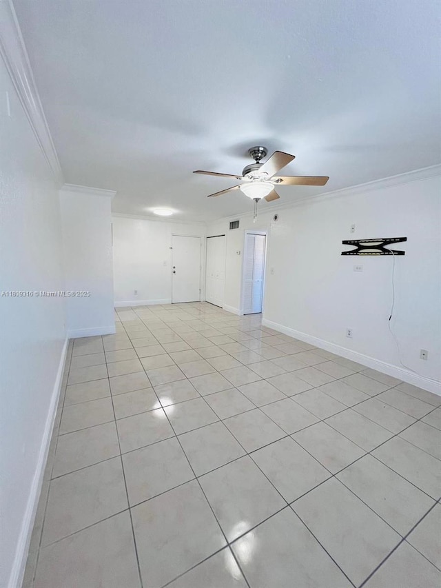 606 W 81st St Unit 224, Hialeah, FL 33014 - unfurnished room with a ceiling fan, crown molding, light tile patterned floors, and baseboards