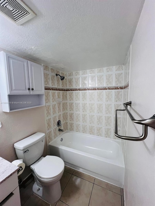 606 W 81st St Unit 224, Hialeah, FL 33014 - bathroom with bathtub / shower combination, toilet, tile patterned floors, vanity, and a textured ceiling