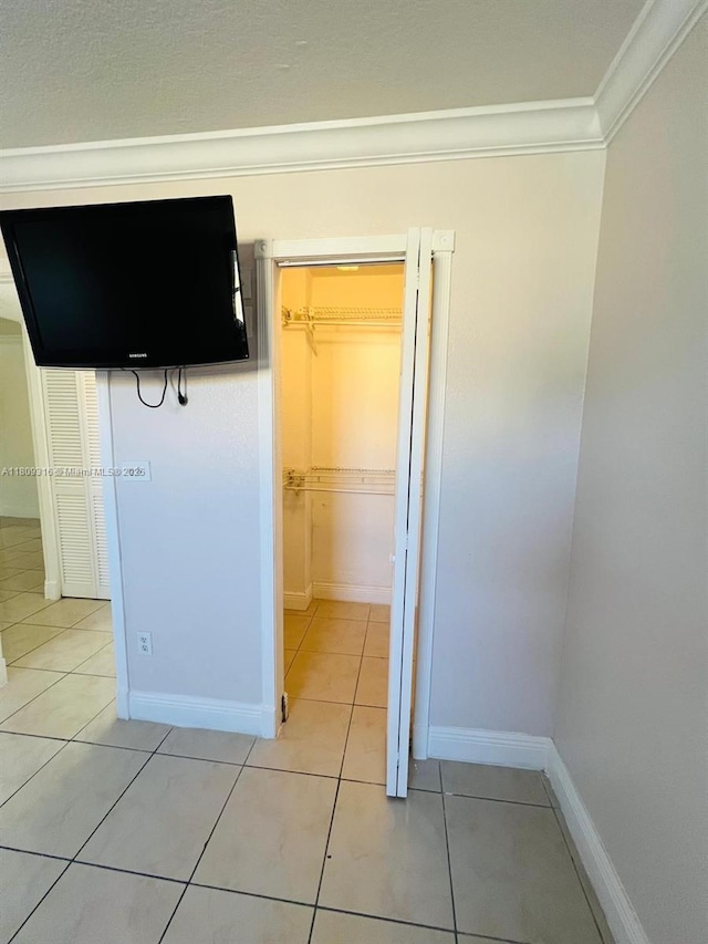 606 W 81st St Unit 224, Hialeah, FL 33014 - interior space with ornamental molding, light tile patterned flooring, and baseboards