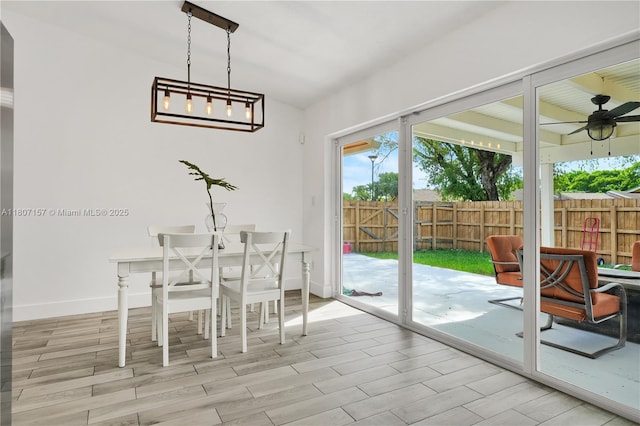 6933 SW 152nd Ct, Miami, FL 33193 - dining room with ceiling fan, vaulted ceiling, wood finished floors, and baseboards