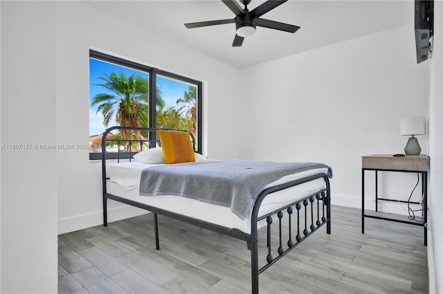 6933 SW 152nd Ct, Miami, FL 33193 - bedroom with baseboards, ceiling fan, and wood finished floors
