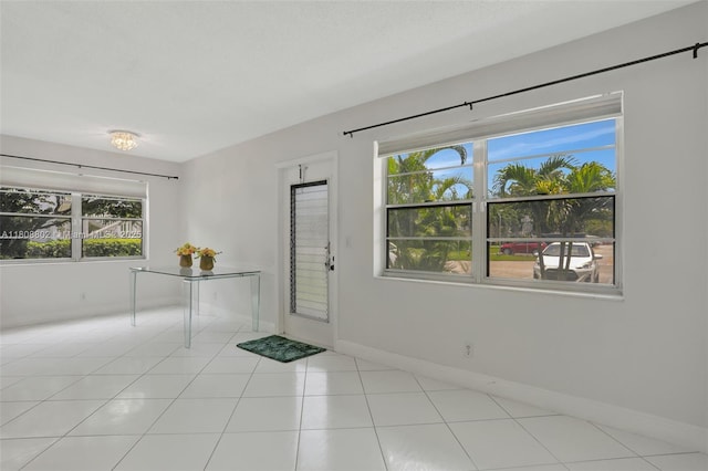 481 Durham Q Unit 481, Deerfield Beach, FL 33442 - tiled spare room featuring healthy amount of natural light and baseboards